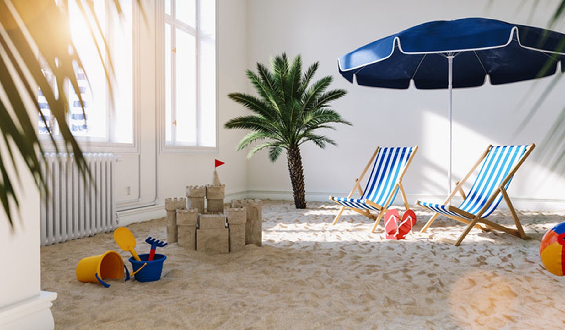 Una habitación con arena de playa, sombrilla, sillas y juguetes
