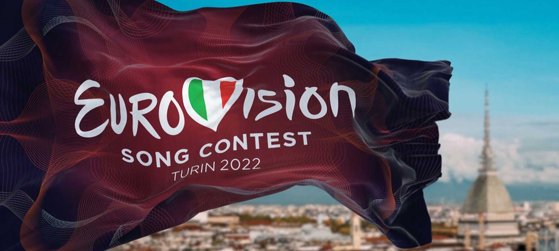 A graphic design that shows a dark red flag waving, with the logo of Eurovision and the text "Song content, Turin 2022" underneath it